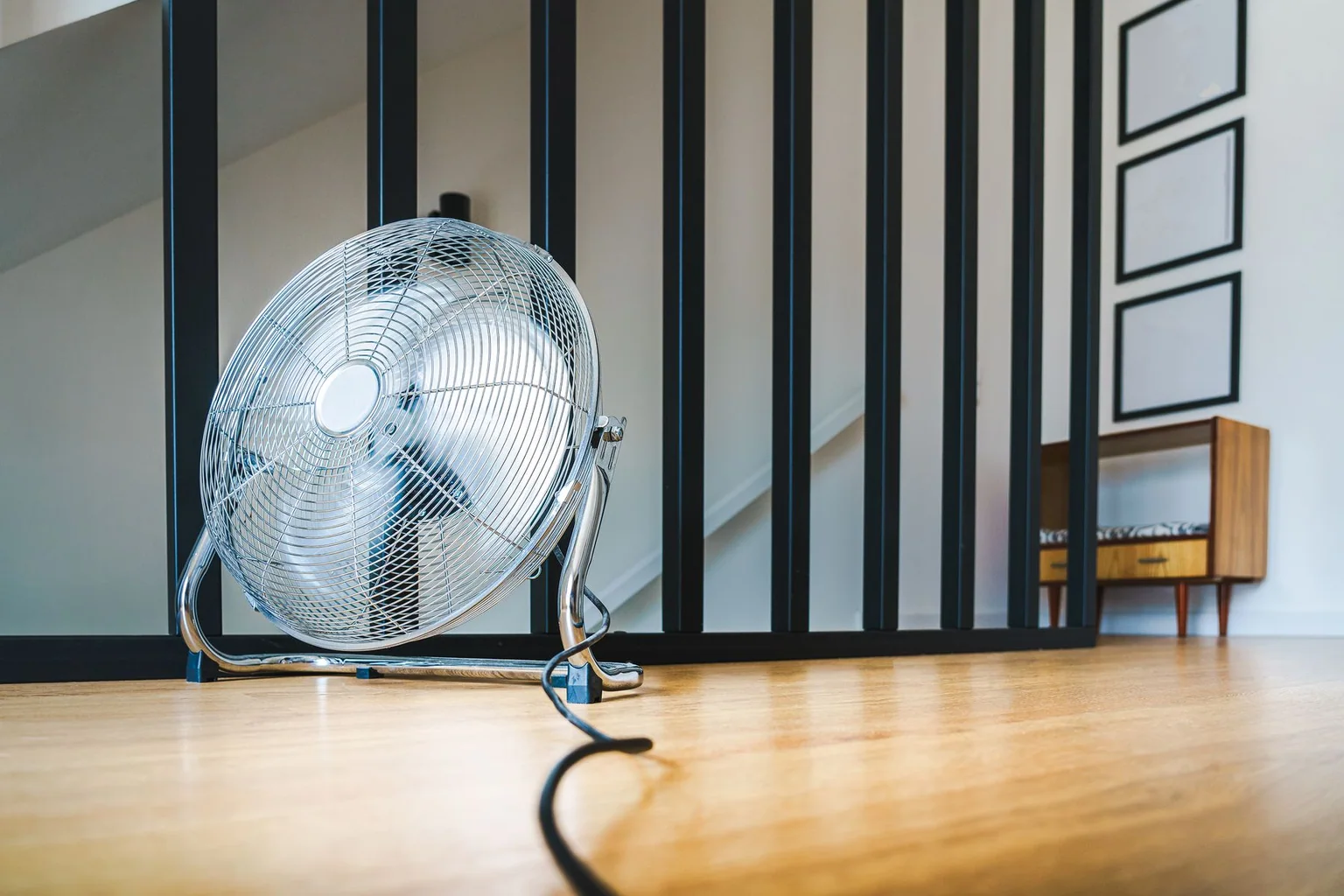 Large floor fan placed in a bright modern living space